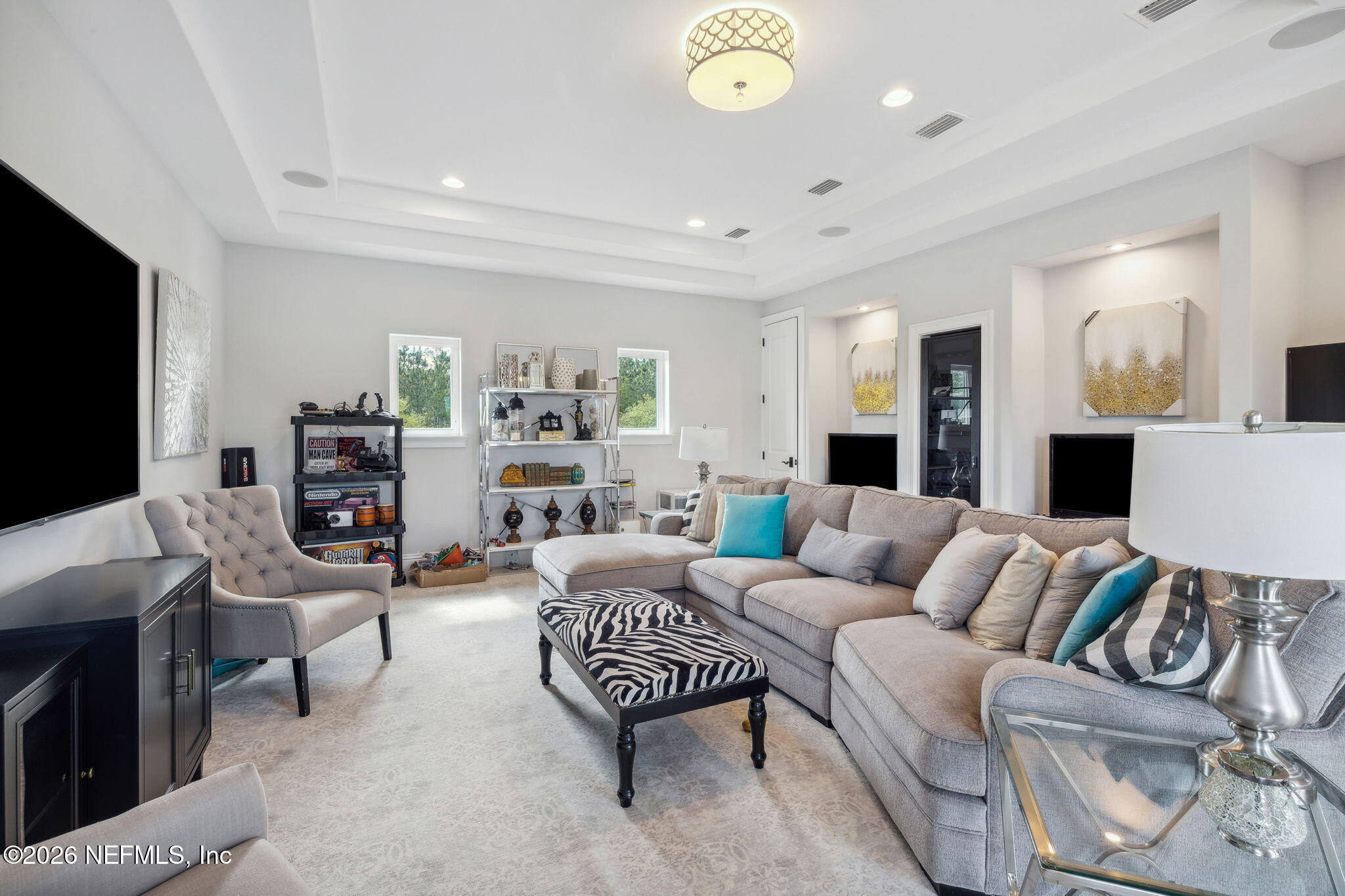 5275 Bentpine Cove Road Jacksonville, FL 32224 - Photo 53 of 95 a living room with furniture and a flat screen tv
