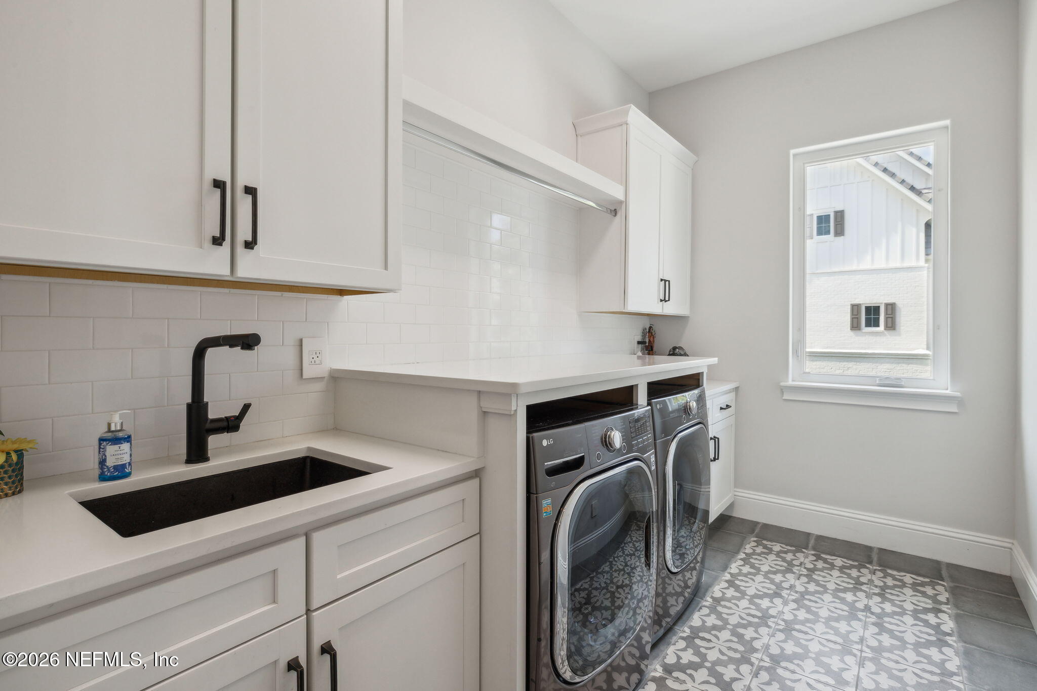 5275 Bentpine Cove Road Jacksonville, FL 32224 - Photo 56 of 95 a kitchen with a sink stove and cabinets