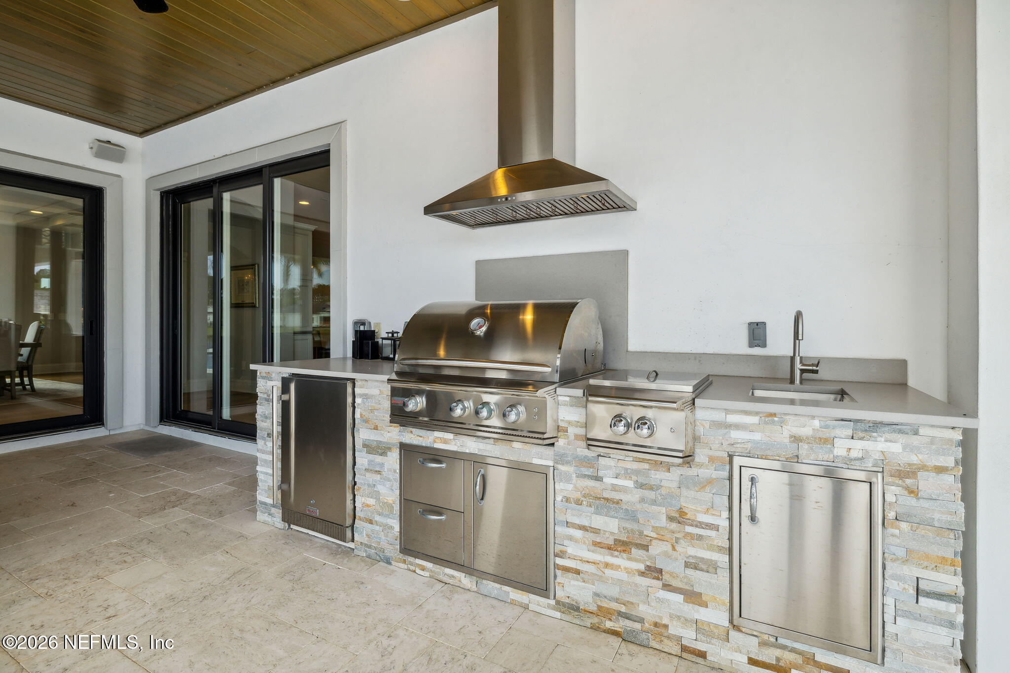 5275 Bentpine Cove Road Jacksonville, FL 32224 - Photo 62 of 95 a kitchen with stainless steel appliances granite countertop a stove and a sink