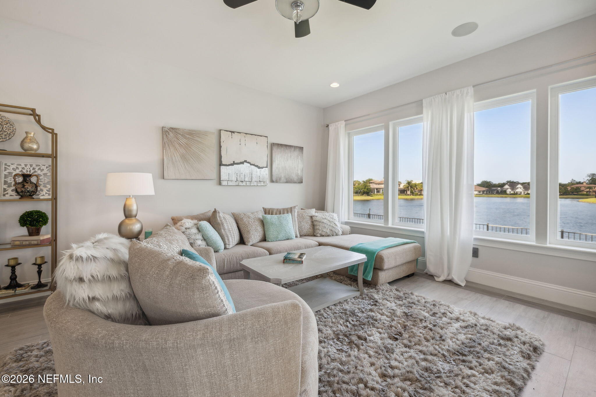5275 Bentpine Cove Road Jacksonville, FL 32224 - Photo 70 of 95 a living room with furniture and a large window