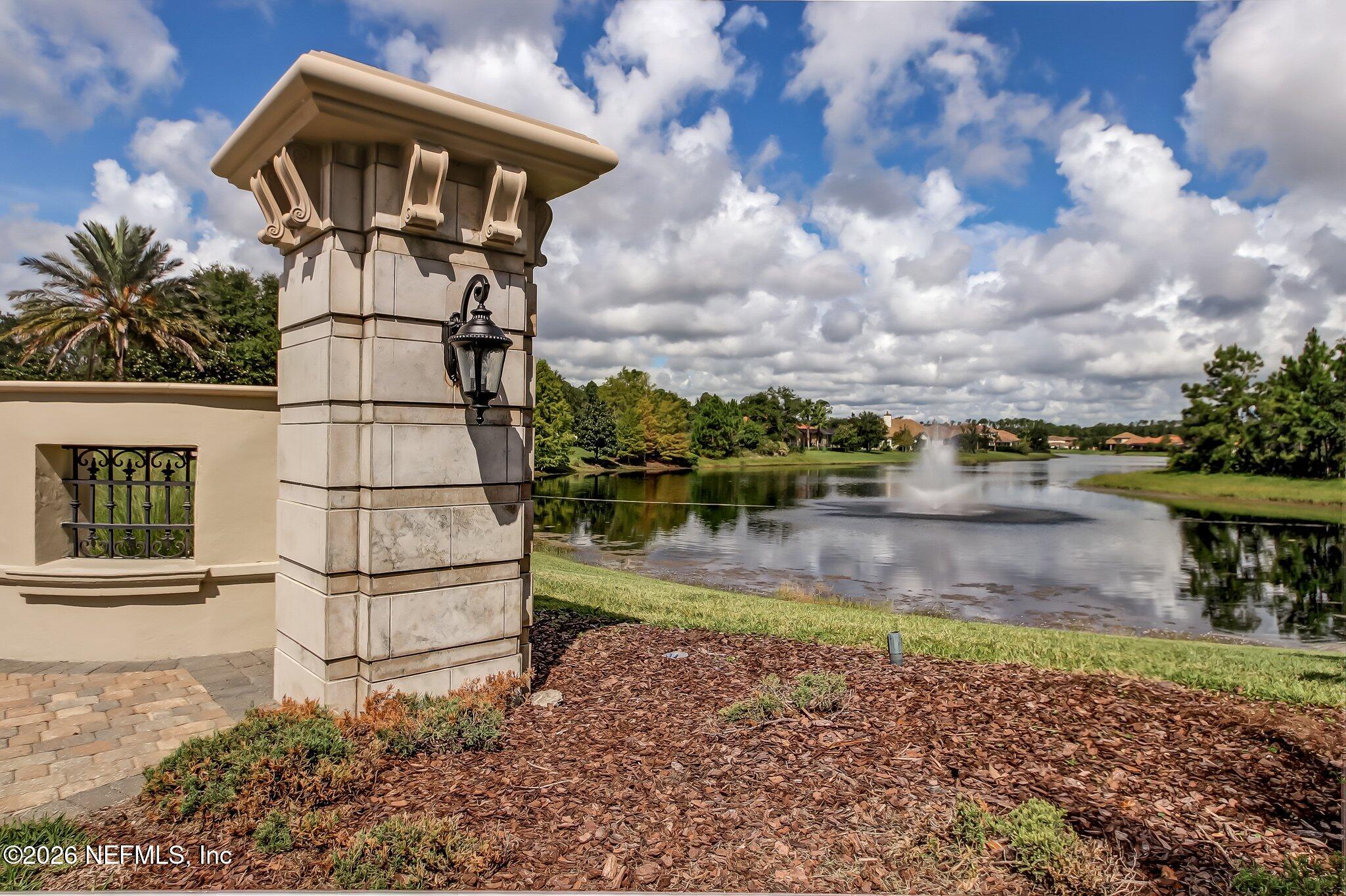 5275 Bentpine Cove Road Jacksonville, FL 32224 - Photo 87 of 95 a view of a lake with a house in the background