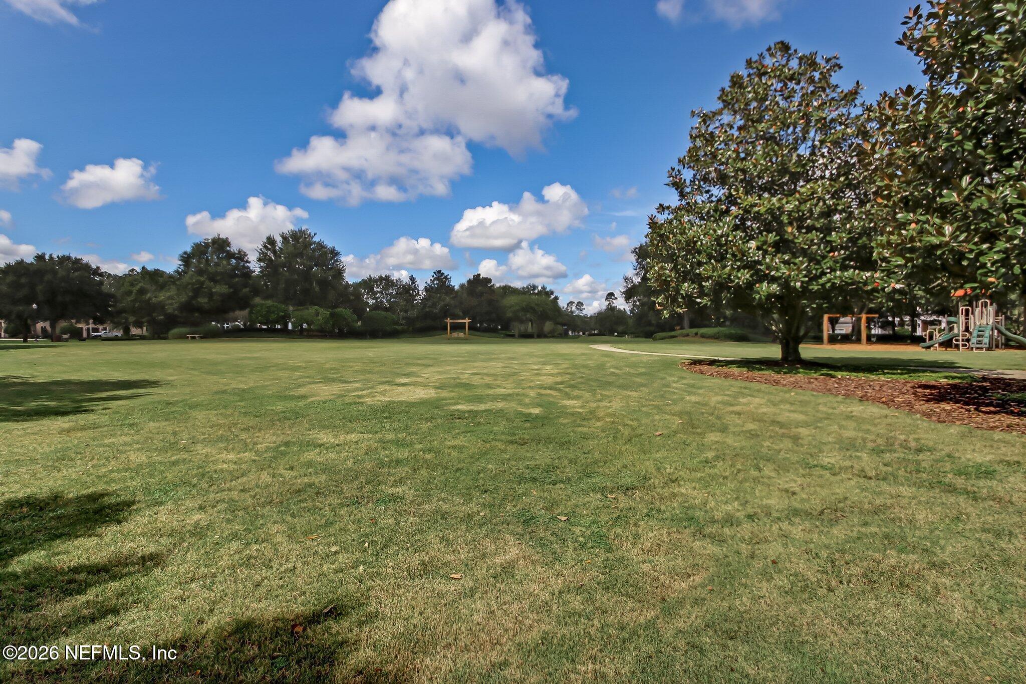 5275 Bentpine Cove Road Jacksonville, FL 32224 - Photo 91 of 95 a view of a golf course with a lake