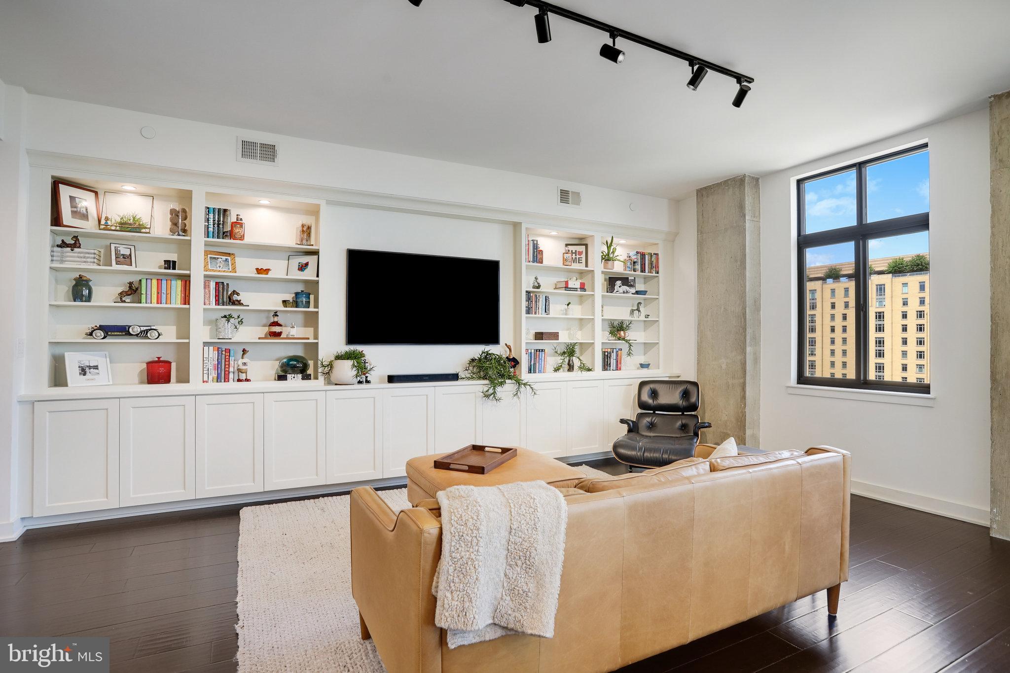 1000 New Jersey Avenue Southeast, Unit 1020 Washington, DC 20003 - Photo 11 of 60 a living room with furniture and a flat screen tv
