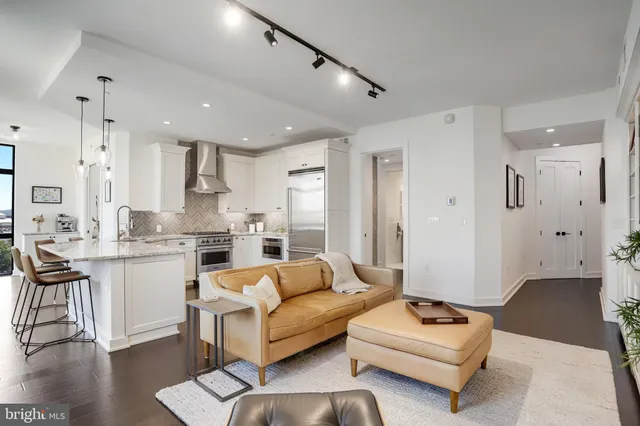 a kitchen with stainless steel appliances granite countertop a stove and a sink