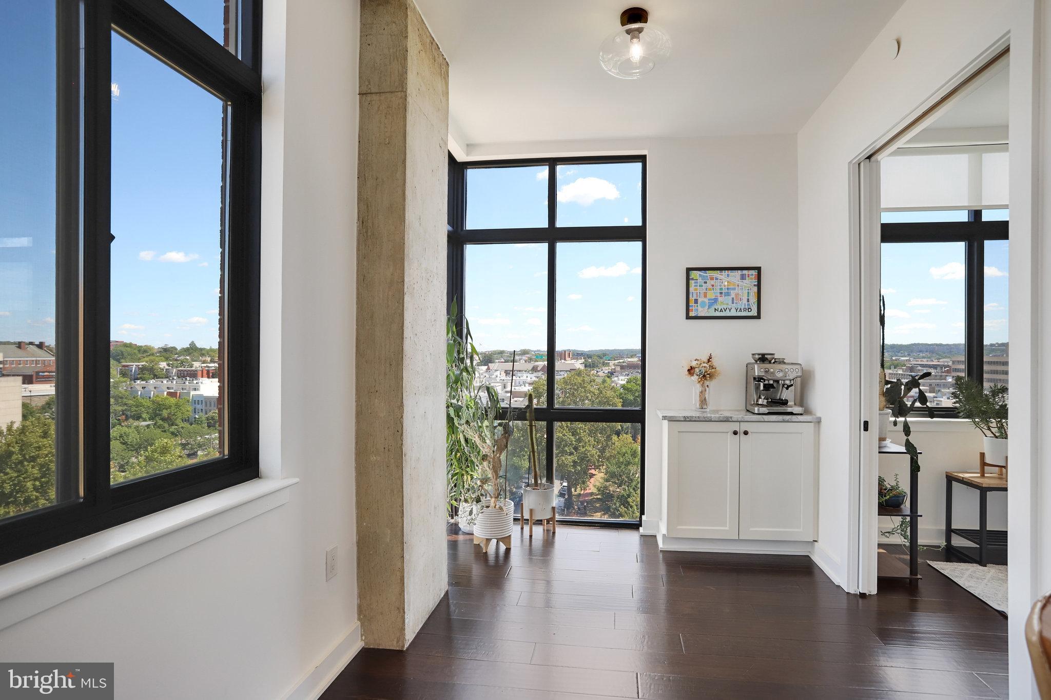 1000 New Jersey Avenue Southeast, Unit 1020 Washington, DC 20003 - Photo 20 of 60 a view of empty room with wooden floor and floor to ceiling window