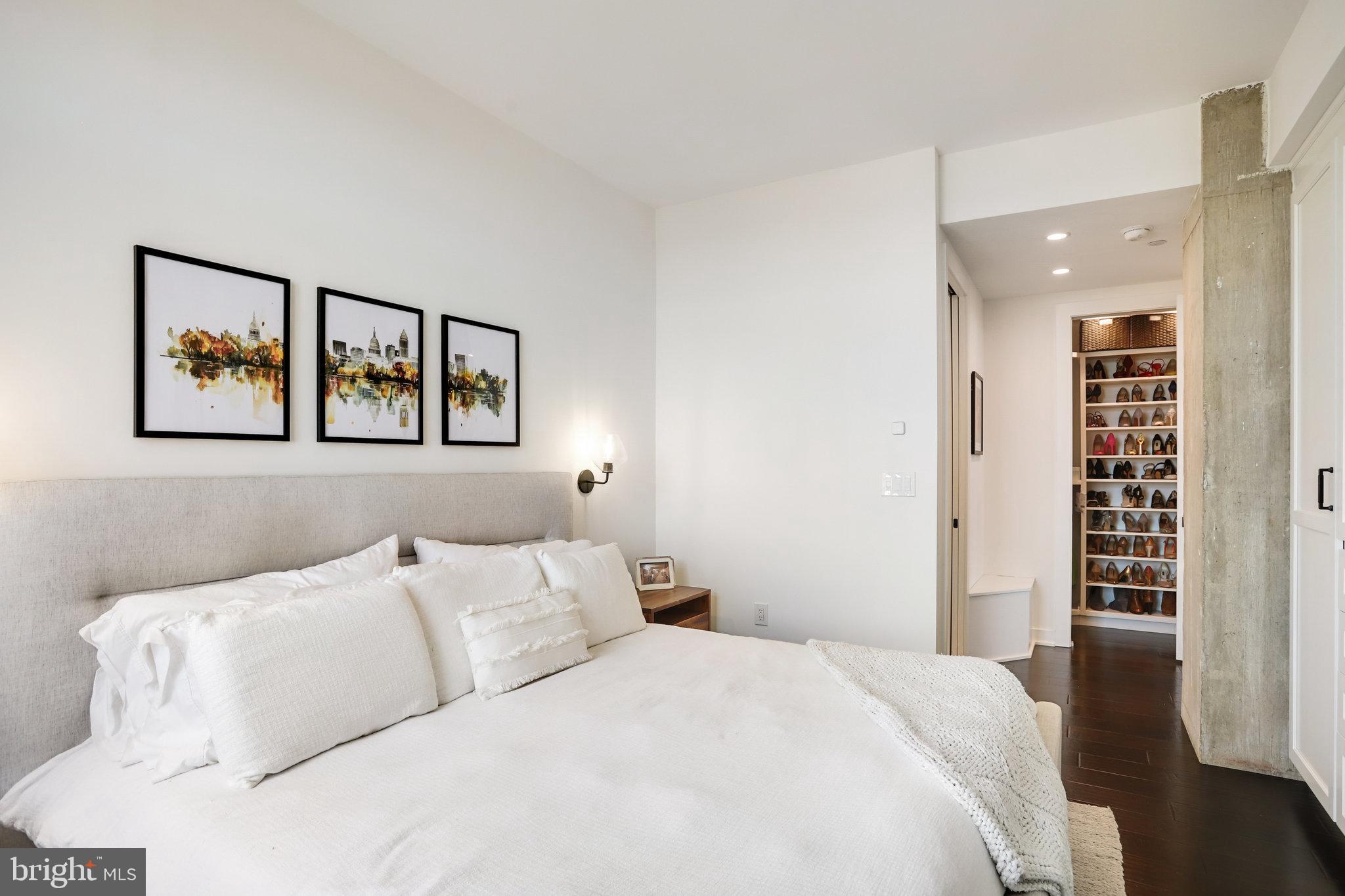 1000 New Jersey Avenue Southeast, Unit 1020 Washington, DC 20003 - Photo 25 of 60 a bedroom with a large bed and a window