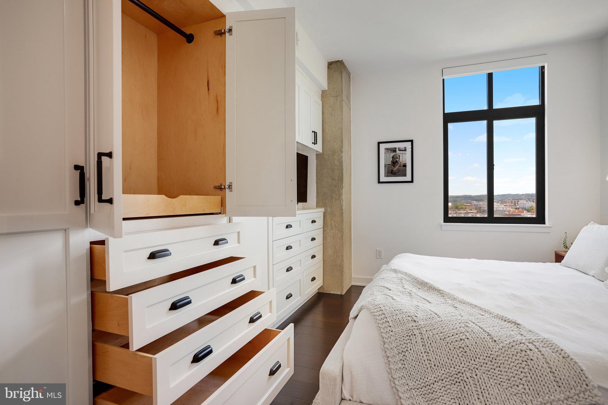 1000 New Jersey Avenue Southeast, Unit 1020 Washington, DC 20003 - Photo 37 of 60 a bedroom with a bed and a window