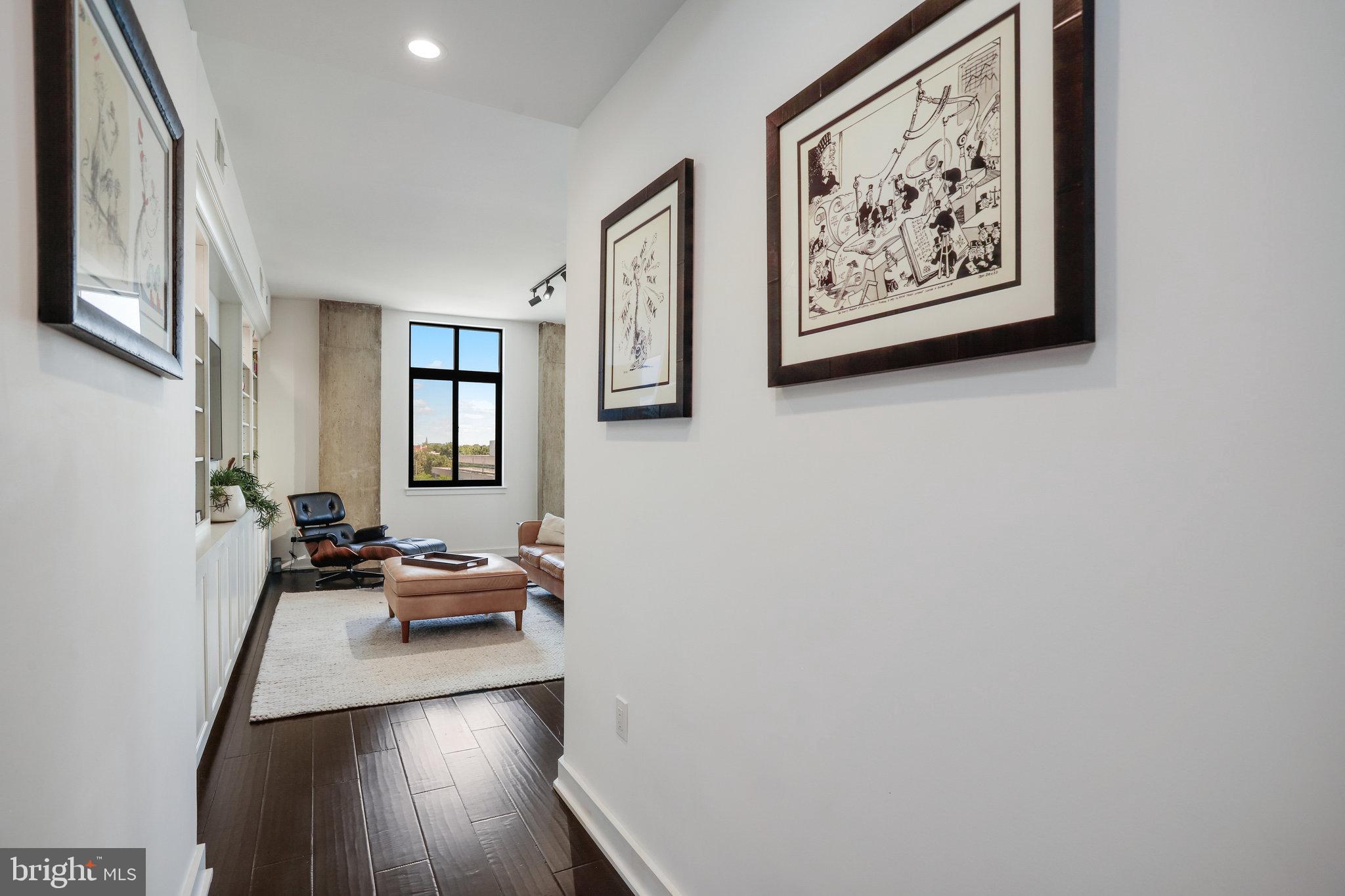 1000 New Jersey Avenue Southeast, Unit 1020 Washington, DC 20003 - Photo 6 of 60 a view of a workspace with furniture and wooden floor