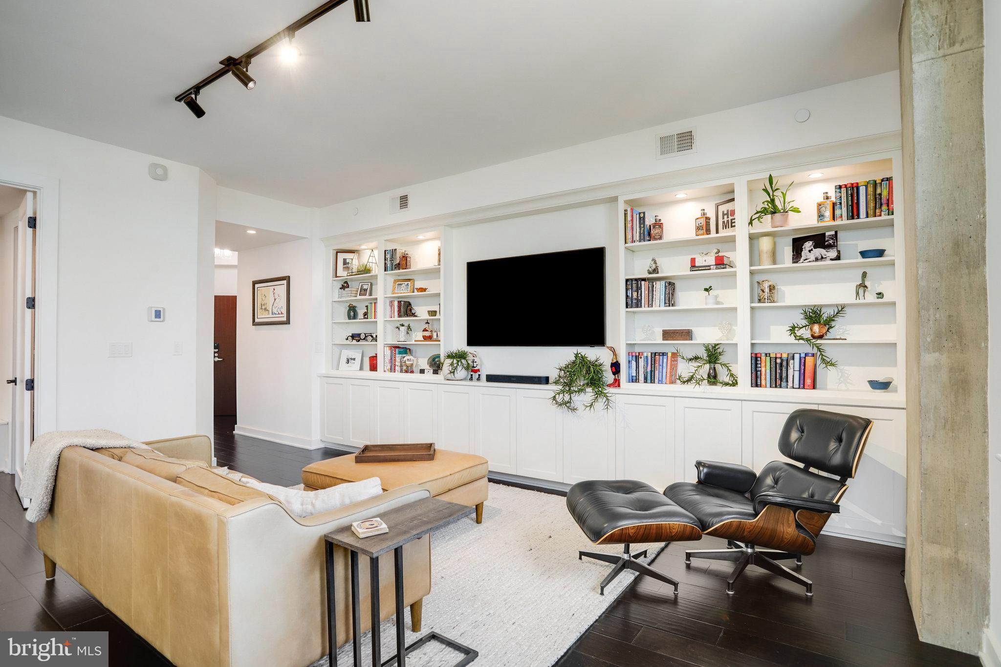1000 New Jersey Avenue Southeast, Unit 1020 Washington, DC 20003 - Photo 9 of 60 a living room with furniture and a flat screen tv