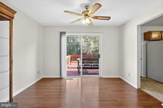 a view of a livingroom with furniture and stairs