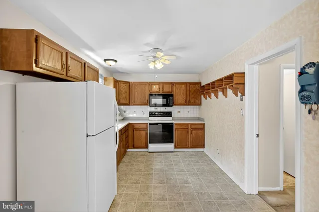 a view of a patio with a table and chairs