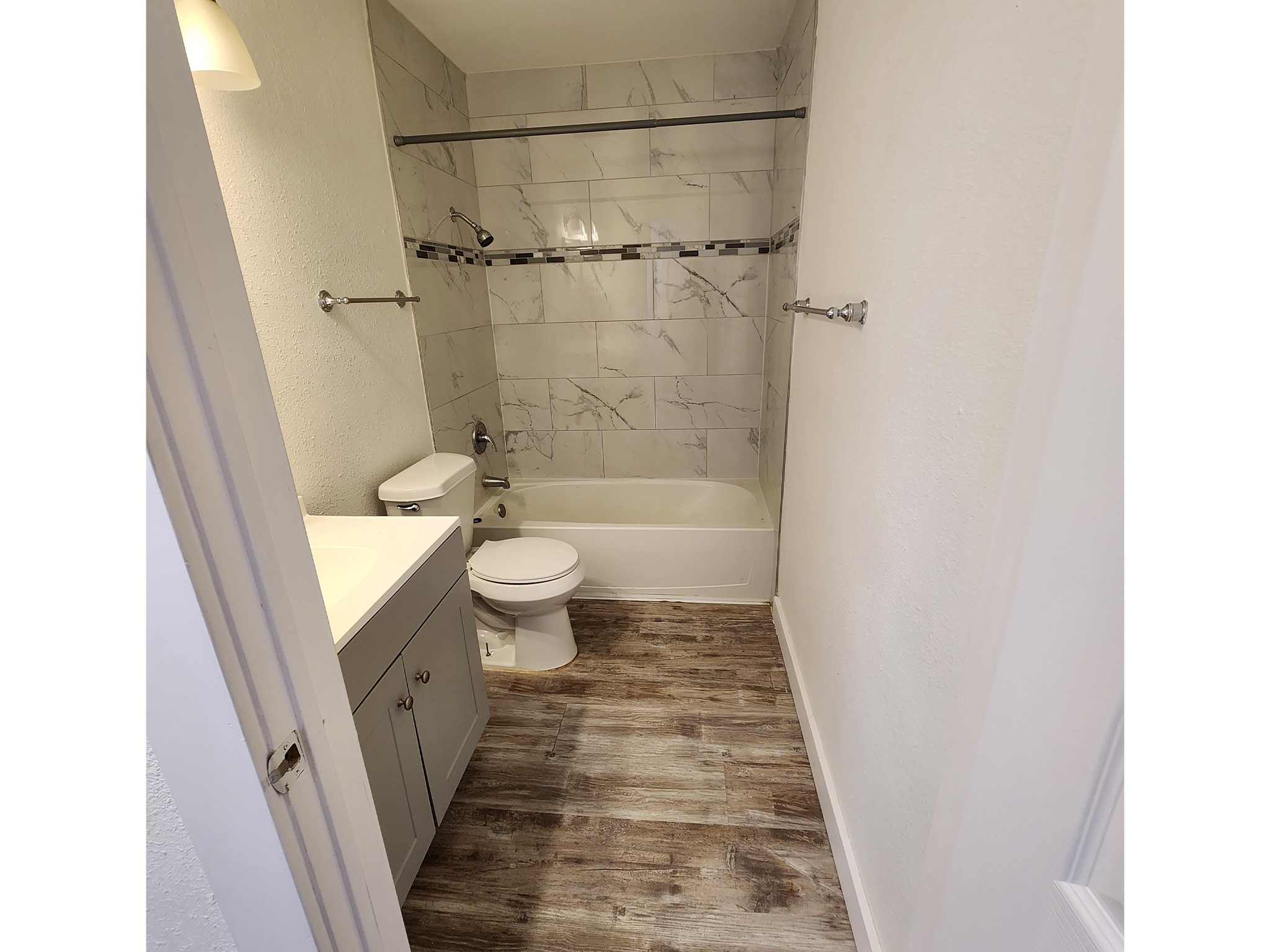 2677 Gessner Road, Unit 203 Houston, TX 77080 - Photo 11 of 11 a bathroom with a sink a toilet and shower