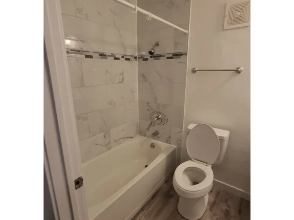 a bathroom with a toilet and a sink