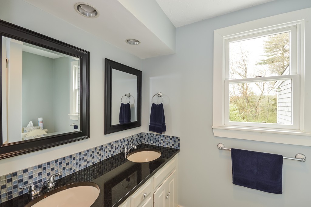 14 Forge Way Duxbury, MA 02332 - Photo 14 of 26 a bathroom with a granite countertop sink and a mirror