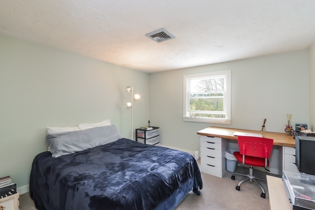 14 Forge Way Duxbury, MA 02332 - Photo 17 of 26 a bedroom with a bed a desk and chair