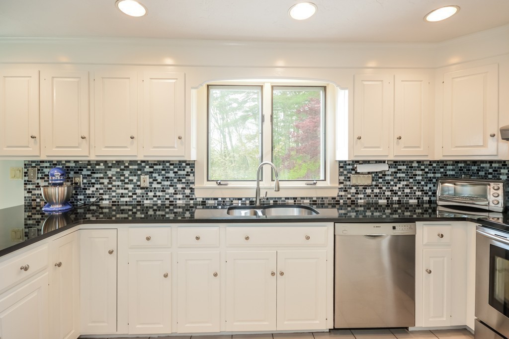14 Forge Way Duxbury, MA 02332 - Photo 3 of 26 a kitchen with granite countertop white cabinets and sink