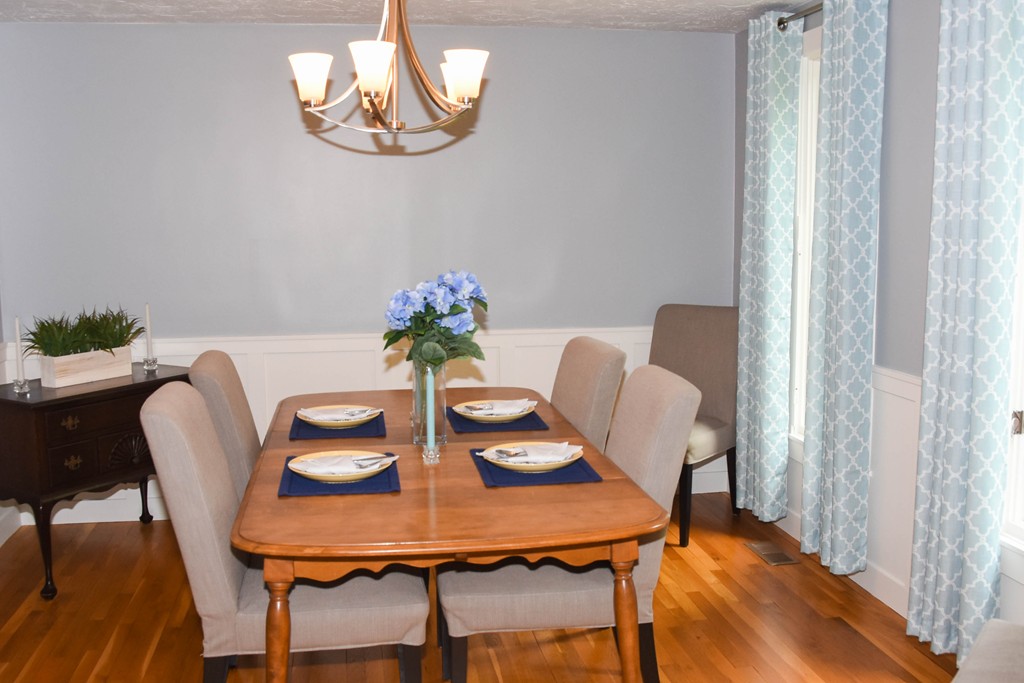 14 Forge Way Duxbury, MA 02332 - Photo 7 of 26 a view of a dining room with furniture and wooden floor