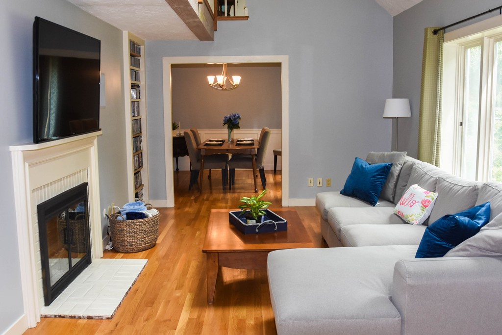 14 Forge Way Duxbury, MA 02332 - Photo 8 of 26 a living room with furniture and a fireplace