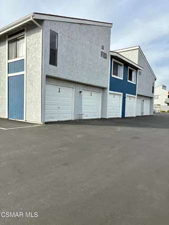 a view of a house with a street