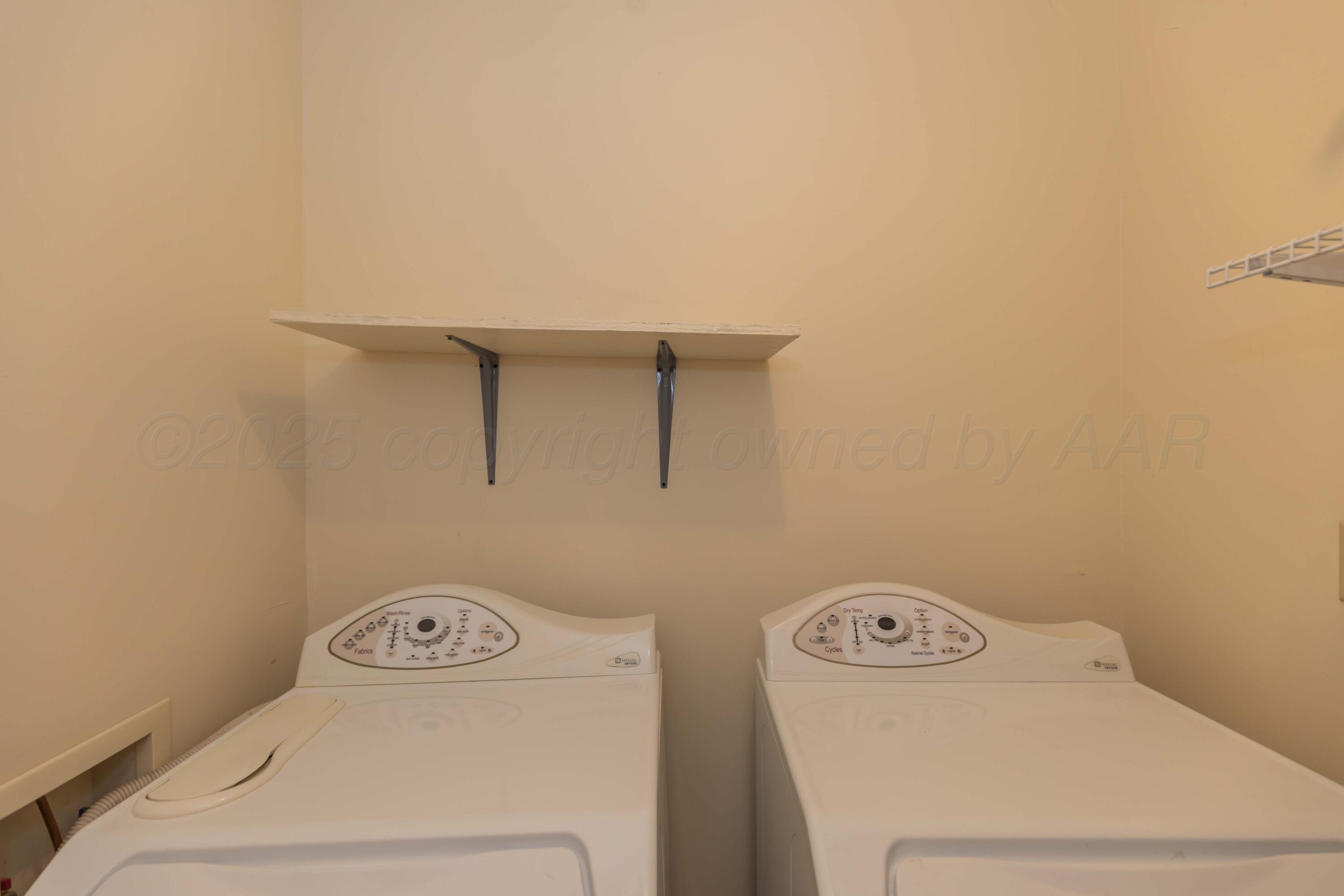 209 East 12th Street Wheeler, TX 79096 - Photo 32 of 40 a utility room with dryer and washer