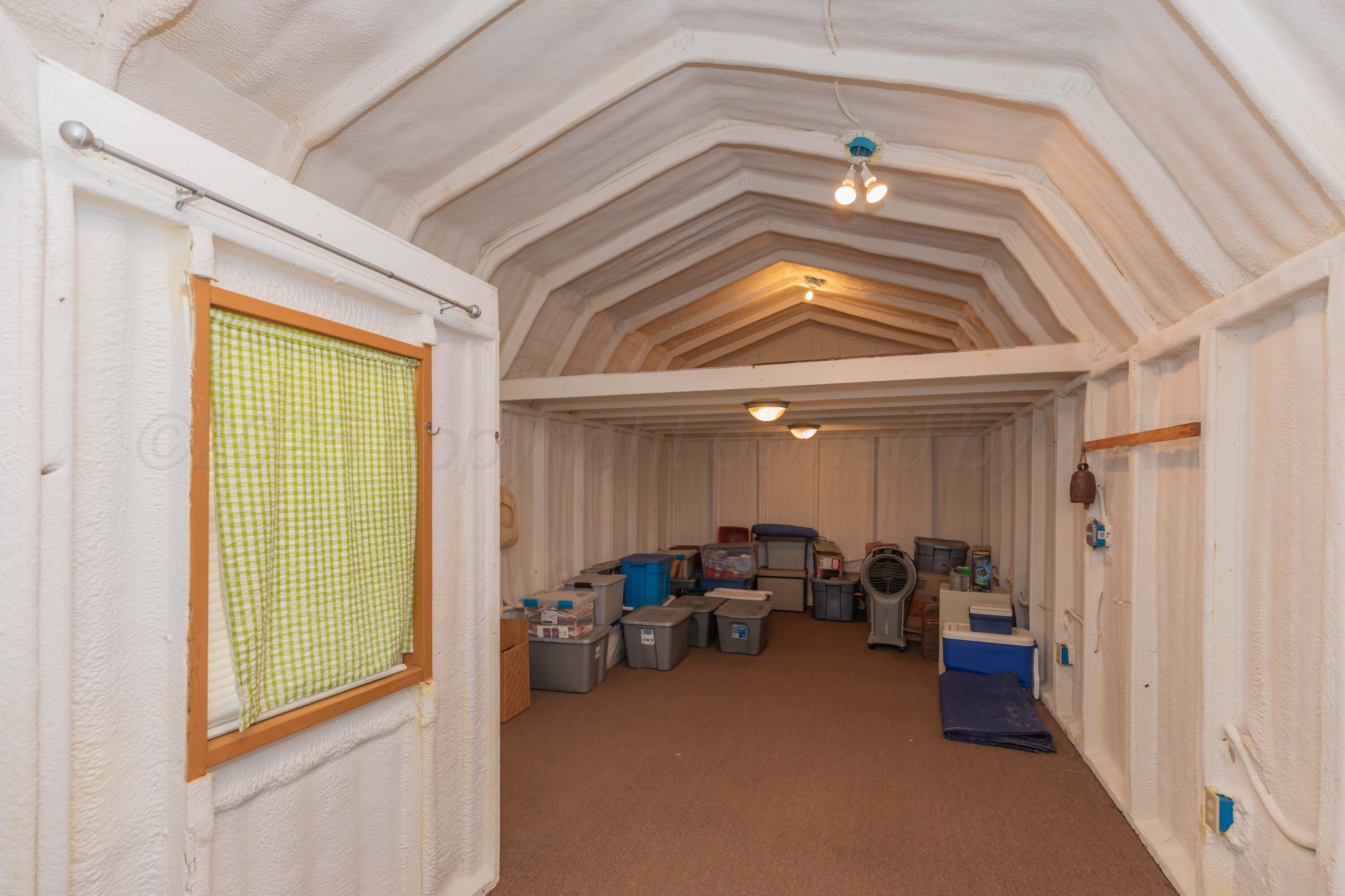 209 East 12th Street Wheeler, TX 79096 - Photo 35 of 40 a view of a livingroom with furniture and a projector