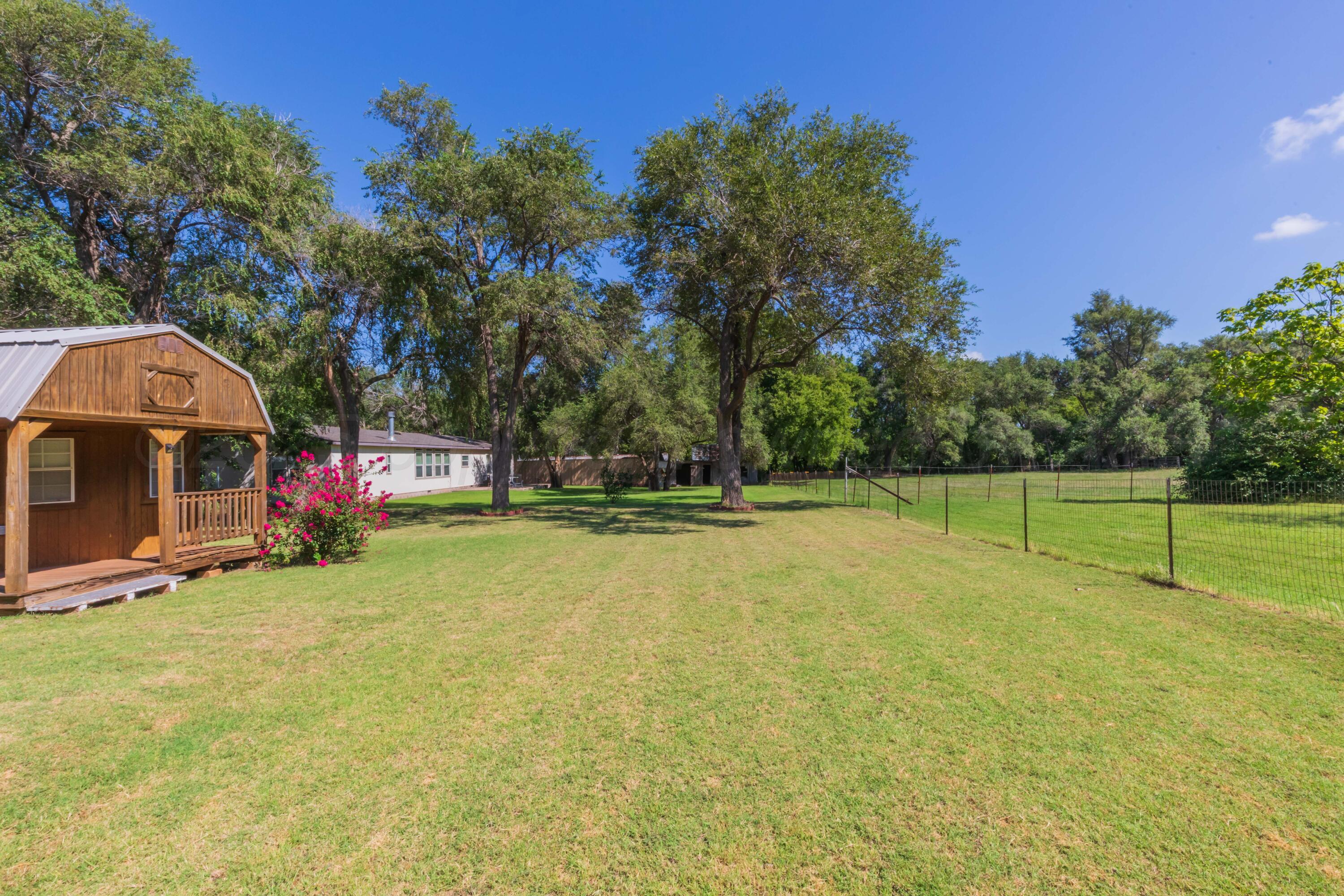 209 East 12th Street Wheeler, TX 79096 - Photo 37 of 40 a view of swimming pool with trees in the background