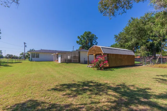 a front view of house with yard and seating area