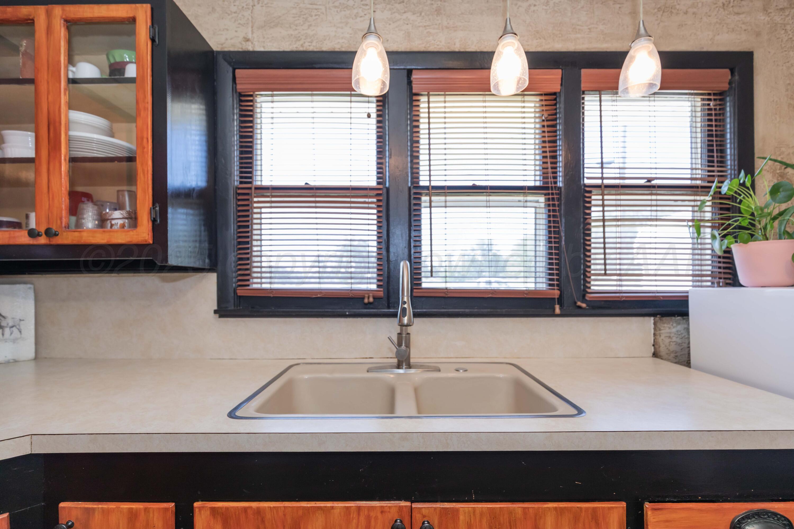 209 East 12th Street Wheeler, TX 79096 - Photo 8 of 40 a view of kitchen with furniture and windows