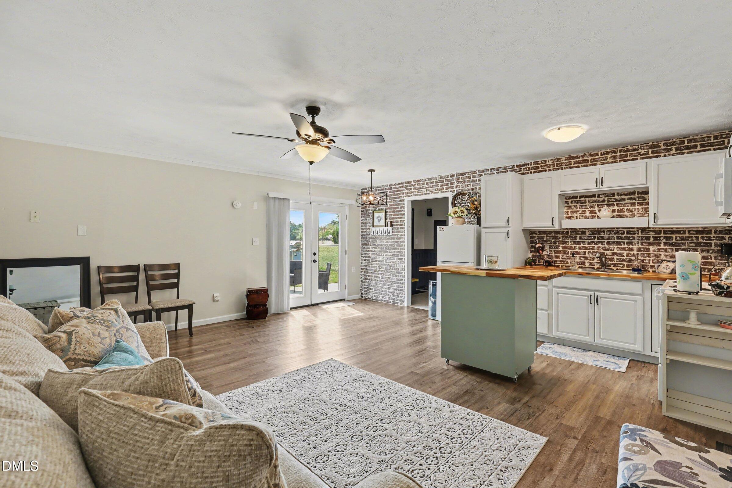 430 Fred Hall Road Stedman, NC 28391 - Photo 56 of 63 a living room with furniture and kitchen view