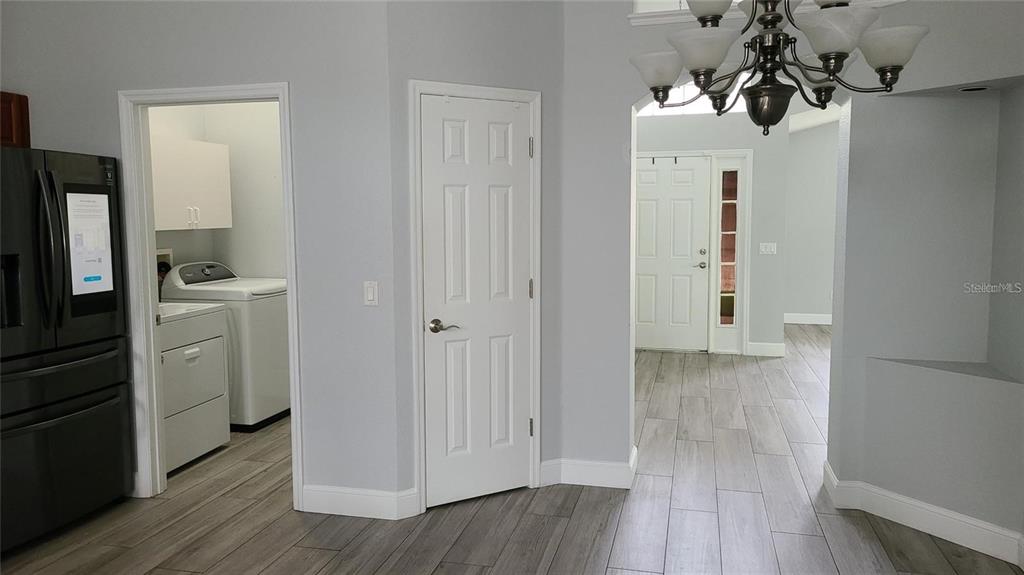 12518 Sparkleberry Road Tampa, FL 33626 - Photo 16 of 24 a view of a kitchen with a refrigerator a sink dishwasher and wooden floor