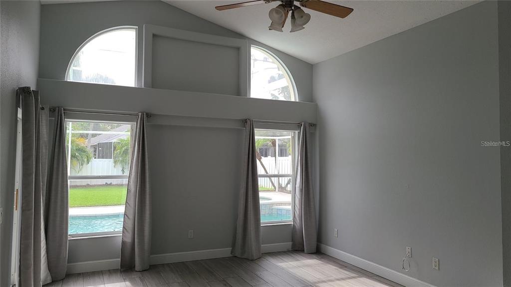 12518 Sparkleberry Road Tampa, FL 33626 - Photo 17 of 24 an entryway to a room with a window and a ceiling fan