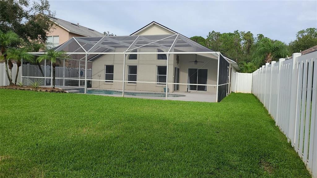 12518 Sparkleberry Road Tampa, FL 33626 - Photo 24 of 24 a view of a house with a yard and sitting area