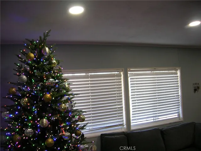 a living room with furniture a couch and a flat screen tv
