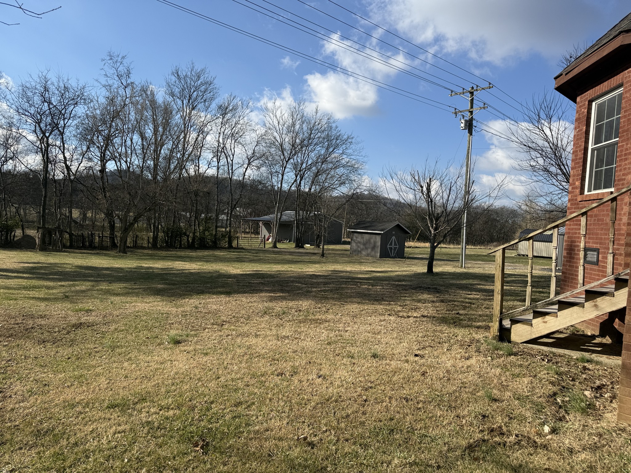 313 Murfreesboro Road Woodbury, TN 37190 - Photo 2 of 8 a view of a house with a yard