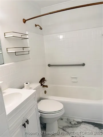 a bathroom with a sink a toilet and a bathtub
