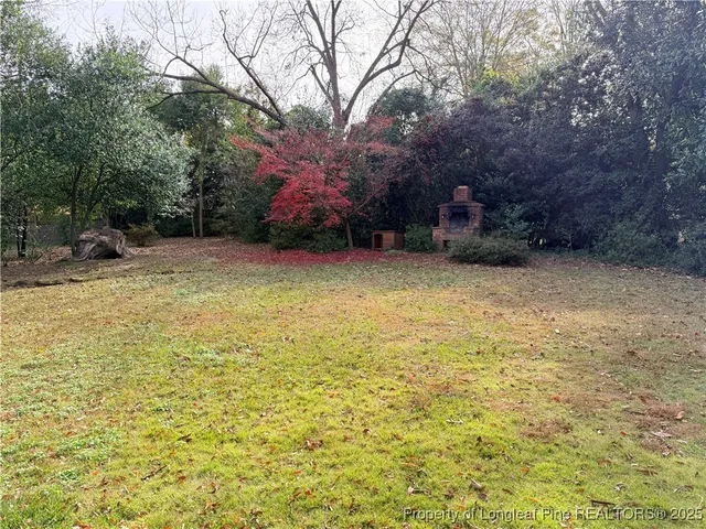a view of a yard with a trees