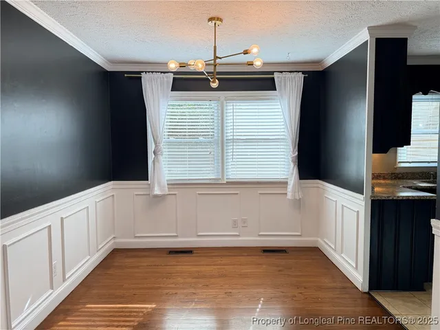 a view of a kitchen with a sink and dishwasher