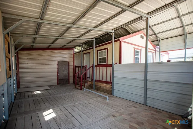a view of a room with wooden walls