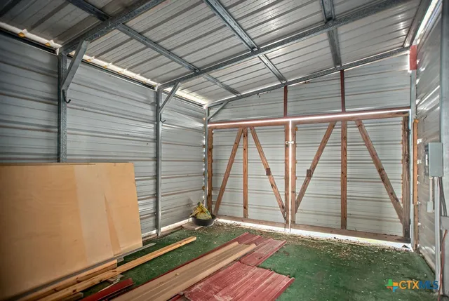 a view of backyard with a large window