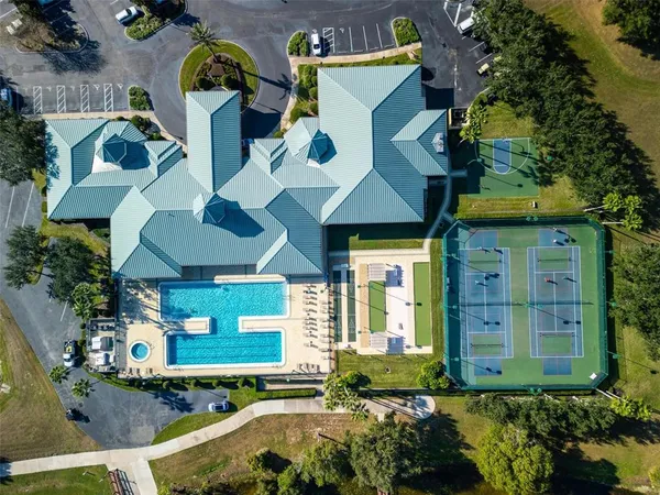 an aerial view of a house with a swimming pool