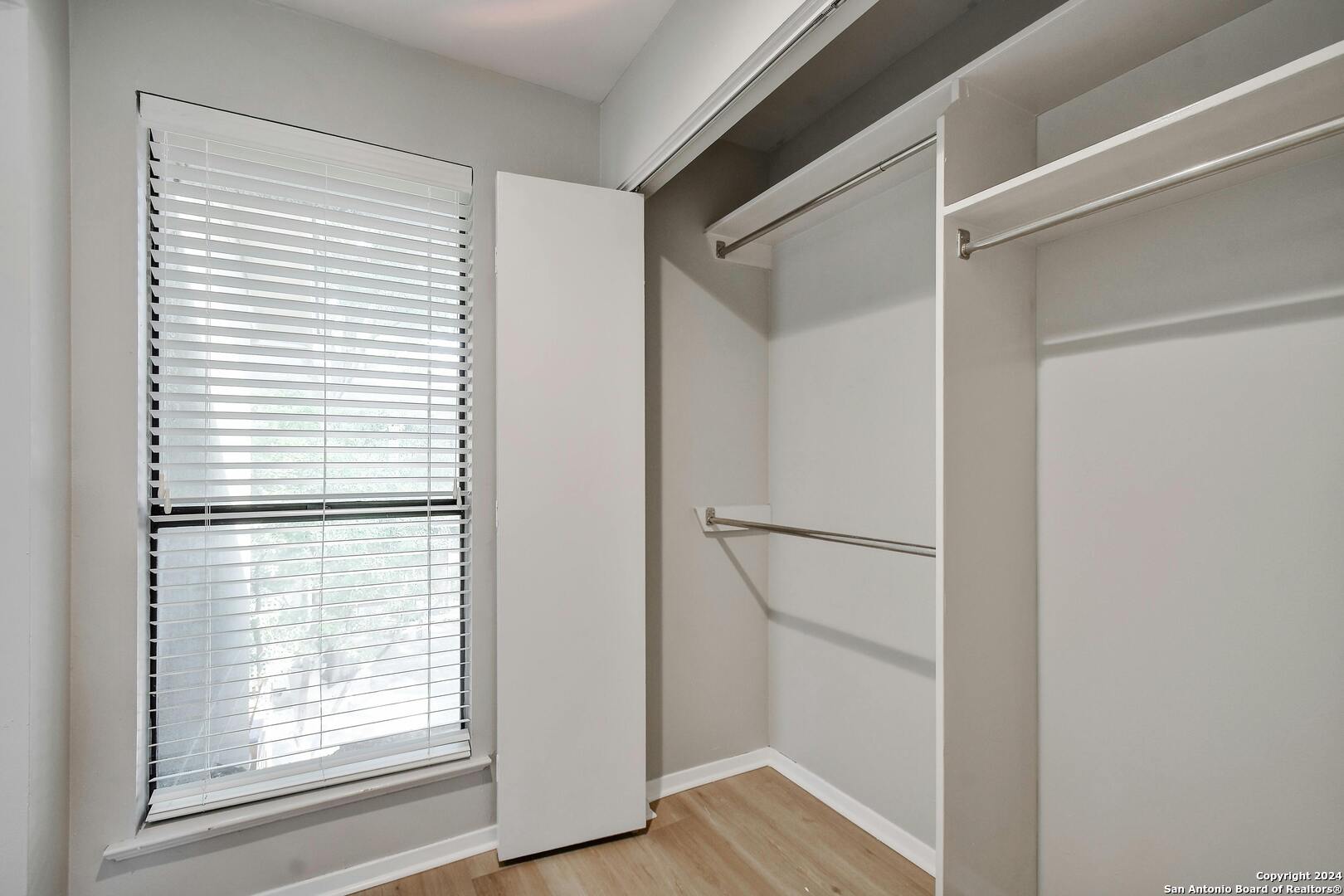 143 Terrell Road, Unit 1/2 San Antonio, TX 78209 - Photo 19 of 31 a white refrigerator freezer and a wooden floor
