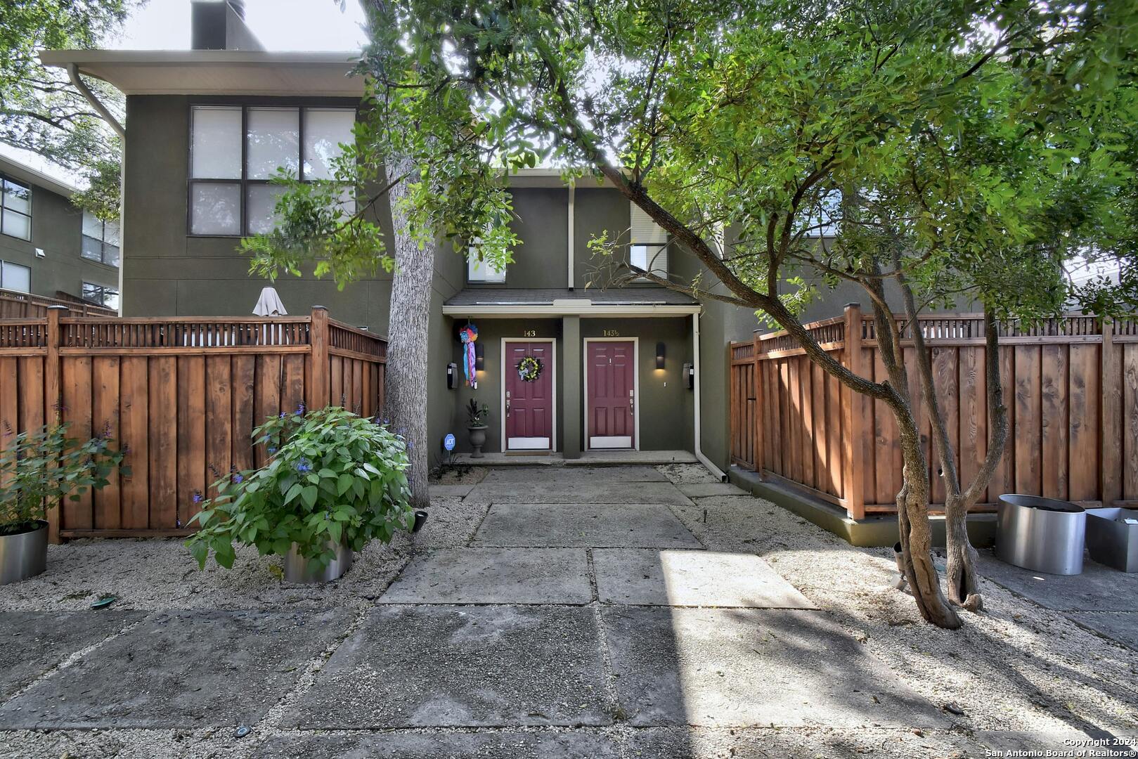 143 Terrell Road, Unit 1/2 San Antonio, TX 78209 - Photo 2 of 31 a front view of a house with garden