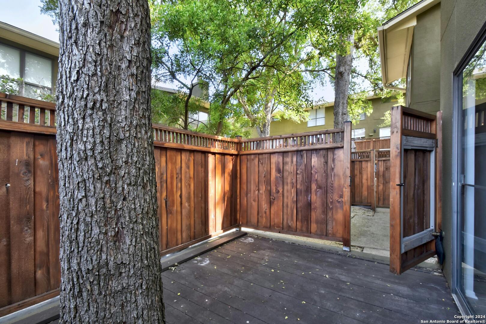 143 Terrell Road, Unit 1/2 San Antonio, TX 78209 - Photo 28 of 31 a view of a porch with a tree