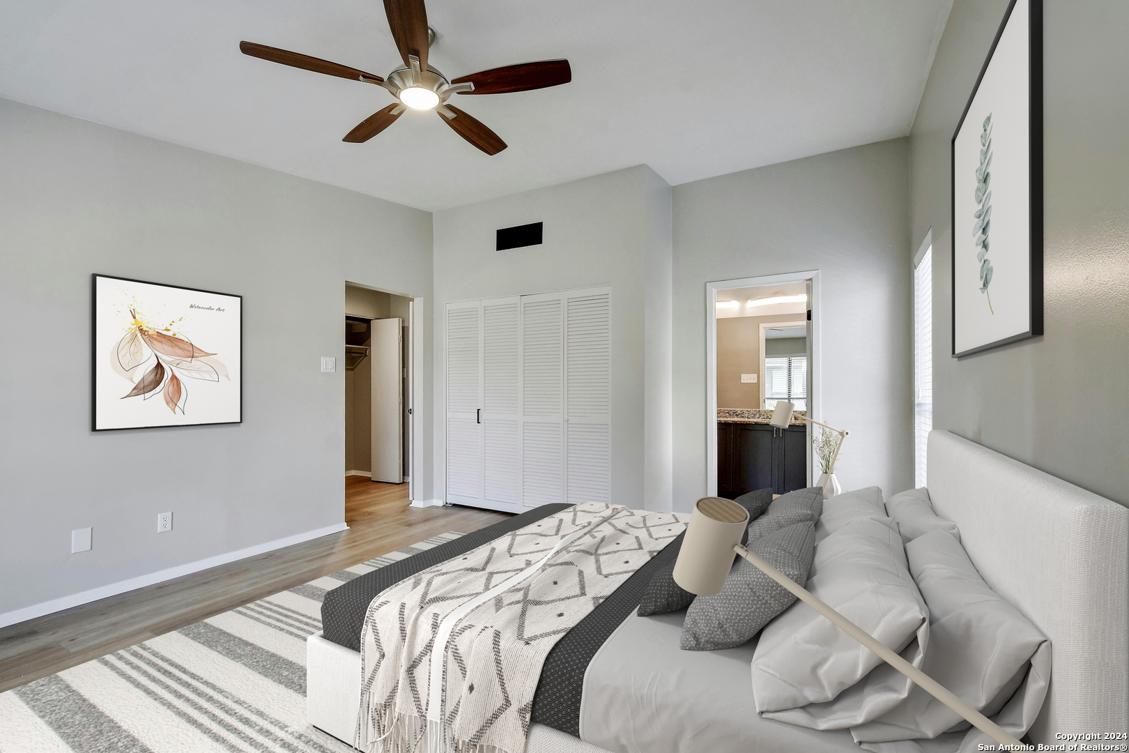 143 Terrell Road, Unit 1/2 San Antonio, TX 78209 - Photo 8 of 31 a bedroom with a large bed and a chandelier