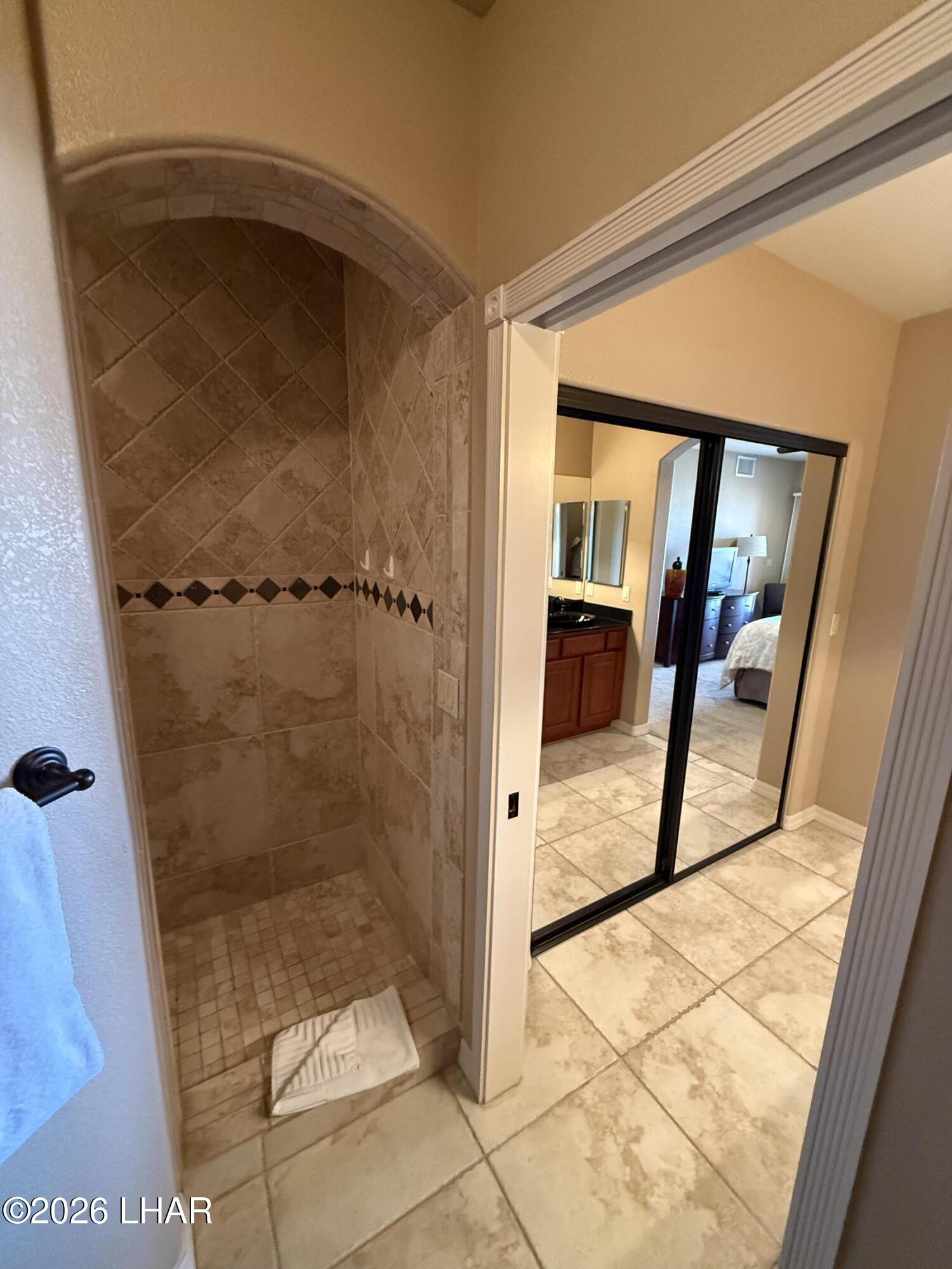 433 London Bridge Road, Unit B101 Lake Havasu City, AZ 86403 - Photo 28 of 35 a bathroom with a glass shower door