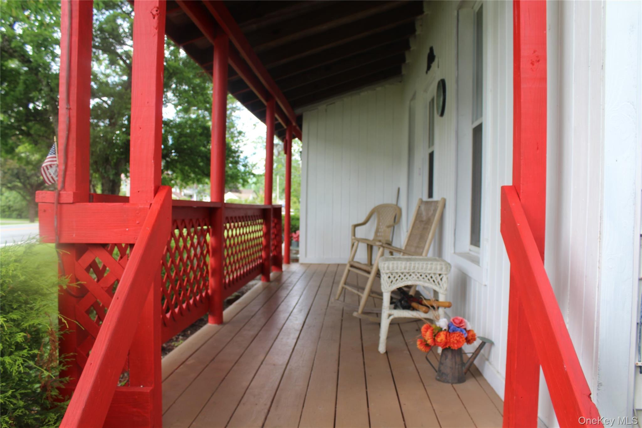 196 Rockland Road Roscoe, NY 12776 - Photo 12 of 38 Covered front porch featuring a wood-finish floor and white vertical siding