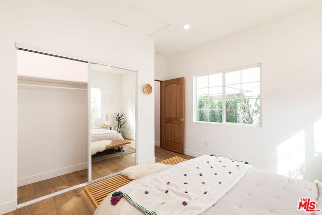 a bedroom with a bed and a view of bathroom