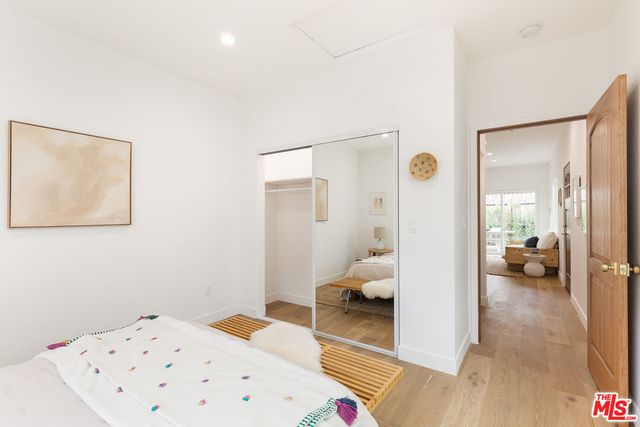 a bathroom with a sink mirror and toilet
