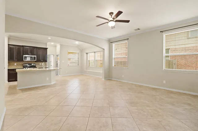 a view of a kitchen with microwave and cabinets