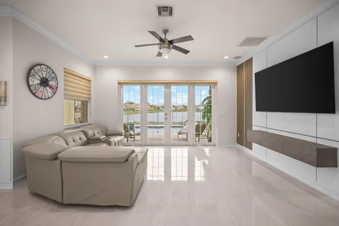 a view of a living room and a floor to ceiling window